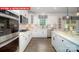 Modern kitchen showcases white cabinets, stainless steel appliances, and a stylish backsplash at 156 Asmodean Ln, Troutman, NC 28166