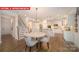 Spacious kitchen with white cabinets, stainless steel appliances, and a center island at 156 Asmodean Ln, Troutman, NC 28166