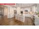 Bright kitchen featuring an island with counter seating, stainless steel appliances, and lots of storage at 156 Asmodean Ln, Troutman, NC 28166