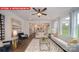 View of the living room with a ceiling fan, open floor plan, and lots of natural light at 156 Asmodean Ln, Troutman, NC 28166