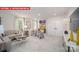 Bright living room with neutral palette, modern furnishings, and ample natural light at 156 Asmodean Ln, Troutman, NC 28166