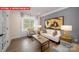 Inviting living room with hardwood floors, neutral walls, and comfortable seating at 156 Asmodean Ln, Troutman, NC 28166