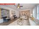View of the living room with a ceiling fan, open floor plan, and lots of natural light at 156 Asmodean Ln, Troutman, NC 28166