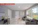 Comfortable sitting area with stylish chairs, ample natural light, and a serene ambiance at 156 Asmodean Ln, Troutman, NC 28166