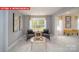 Cozy sitting room with neutral colors, plush seating, and large windows for natural light at 156 Asmodean Ln, Troutman, NC 28166