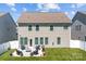 Spacious backyard with a patio area, outdoor furniture, and well-maintained landscaping, perfect for outdoor entertaining at 187 Longleaf Dr, Mooresville, NC 28117