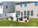 The backyard features an open patio area with outdoor furniture and well-maintained landscaping at 187 Longleaf Dr, Mooresville, NC 28117