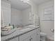 Bathroom featuring a vanity with granite countertop, white cabinets, and a combined tub and shower at 187 Longleaf Dr, Mooresville, NC 28117