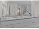 Bathroom featuring double sinks with granite counters, and a walk-in shower in a neutral color palette at 187 Longleaf Dr, Mooresville, NC 28117