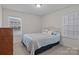 Cozy bedroom featuring a double window, neutral carpet, and a comfortable bed with decorative pillows at 187 Longleaf Dr, Mooresville, NC 28117