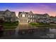 Inviting two-story home with a two-car garage, manicured lawn and a cozy front porch at 187 Longleaf Dr, Mooresville, NC 28117