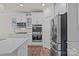 Modern kitchen with stainless steel appliances, white cabinetry, and sleek countertops at 187 Longleaf Dr, Mooresville, NC 28117