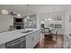 A kitchen island overlooks a breakfast nook and living area with stone fireplace at 187 Longleaf Dr, Mooresville, NC 28117