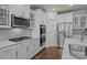 Modern kitchen featuring stainless steel appliances, white cabinets, and a sleek design at 187 Longleaf Dr, Mooresville, NC 28117