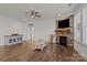 Open-concept living room showcasing hardwood floors, a stone fireplace, and plenty of space at 187 Longleaf Dr, Mooresville, NC 28117