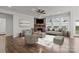 An open living area featuring a corner fireplace, comfortable seating, and natural light at 187 Longleaf Dr, Mooresville, NC 28117