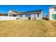 A spacious backyard with a covered grill, dining area, and lush lawn, perfect for outdoor entertaining at 19010 Hawk Haven Ln, Charlotte, NC 28278