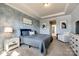 This bedroom features carpet, neutral walls, decor, lots of natural light, and tray ceilings at 19010 Hawk Haven Ln, Charlotte, NC 28278