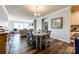 Open concept dining area with stylish table, chairs, and elegant decor throughout the home at 19010 Hawk Haven Ln, Charlotte, NC 28278