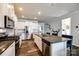 Spacious kitchen with stainless steel appliances, ample counter space, white cabinets, and an open design at 19010 Hawk Haven Ln, Charlotte, NC 28278