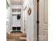 Inviting mudroom with a built-in storage, coat hooks, and decorative details on the walls and cabinets at 19010 Hawk Haven Ln, Charlotte, NC 28278