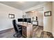 Bright and airy home office featuring a modern desk setup and views into other rooms, creating a productive workspace at 19010 Hawk Haven Ln, Charlotte, NC 28278
