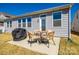 Outdoor patio with a dining table and cushioned wicker chairs offers a cozy space for relaxing and entertaining at 19010 Hawk Haven Ln, Charlotte, NC 28278