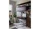 Modern office space featuring a sleek built-in desk and shelving unit with a stylish, clear chair at 2100 Endeavor Run, Charlotte, NC 28269