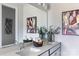 Bright bathroom with a double vanity, a large mirror, modern lighting fixtures, and decorative greenery at 2108 Endeavor Run, Charlotte, NC 28269