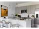 Modern kitchen featuring gray cabinets, stainless steel appliances, a white countertop, and pendant lighting at 2108 Endeavor Run, Charlotte, NC 28269