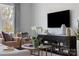 Cozy living room showcasing a black entertainment center, neutral furniture, and a stylish round coffee table at 2108 Endeavor Run, Charlotte, NC 28269