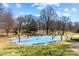 Recreational basketball court surrounded by trees, ideal for outdoor activities at 2125 Kenilworth Ave, Charlotte, NC 28203