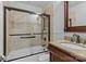 Modern bathroom featuring a glass-enclosed shower, granite vanity, and updated fixtures for a luxurious feel at 2125 Kenilworth Ave, Charlotte, NC 28203