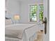 Cozy bedroom with view through vintage glass door knob; features soft lighting and inviting decor at 2125 Kenilworth Ave, Charlotte, NC 28203