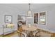 Elegant dining room with a chandelier, neutral colored walls, and access to living spaces at 2125 Kenilworth Ave, Charlotte, NC 28203