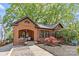 Beautiful brick home features manicured landscaping, black shutters, and inviting front porch at 2125 Kenilworth Ave, Charlotte, NC 28203