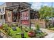 Kid Cashew with rustic signage and lush greenery around the exterior, creating an inviting atmosphere at 2125 Kenilworth Ave, Charlotte, NC 28203