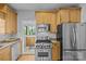Well-equipped kitchen featuring stainless steel appliances, wooden cabinets, and granite countertops for a modern cooking experience at 2125 Kenilworth Ave, Charlotte, NC 28203