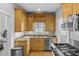 Well-lit kitchen with stainless steel appliances, granite countertops, wood floors and ample cabinet space at 2125 Kenilworth Ave, Charlotte, NC 28203