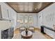 Bright living room features a decorative fireplace, hardwood floors, and neutral color palette at 2125 Kenilworth Ave, Charlotte, NC 28203