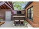 Outdoor bar with a wall mounted television, prep area, and seating perfect for entertaining guests at 2125 Kenilworth Ave, Charlotte, NC 28203
