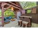 Relaxing outdoor lounge area with comfortable seating, bar, lighting, and wooded views from an elevated deck at 2125 Kenilworth Ave, Charlotte, NC 28203