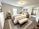 Bright bedroom with neutral tones, a comfortable bed, stylish décor, and ample natural light at 215 Old Dixie Rd, Lancaster, SC 29720