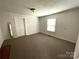 Simple bedroom with a window, neutral walls, and carpeted floors offering a blank canvas for customization at 215 Old Dixie Rd, Lancaster, SC 29720