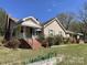 Inviting home with brick accents, front porch, and neat landscaping at 215 Old Dixie Rd, Lancaster, SC 29720