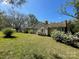 Home featuring a well-maintained lawn, mature trees, and neat landscaping at 215 Old Dixie Rd, Lancaster, SC 29720