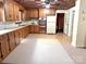 Traditional kitchen with wood cabinets, updated appliances, and plenty of counter space at 215 Old Dixie Rd, Lancaster, SC 29720