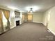 Spacious living room with fireplace, large mirror, and ample natural light at 215 Old Dixie Rd, Lancaster, SC 29720