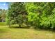 Spacious backyard with mature trees, offering a serene and private outdoor space at 2281 Old Salisbury Concord Rd, Concord, NC 28025