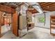 Utility area in unfinished basement with brick accent and shelving at 2281 Old Salisbury Concord Rd, Concord, NC 28025